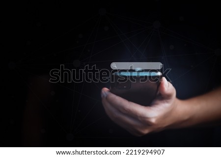 Search Browsing Internet web, cyberspace and technology Concept.  Man using smartphone and search button on virtual screen searching information data ,website,networking,research keyword.
