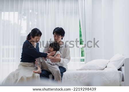 A family with an energetic little girl