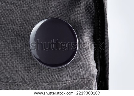 Close up of black badges pin on school bag Royalty-Free Stock Photo #2219300109