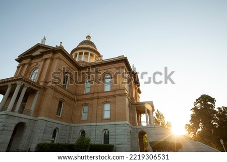 Sunlight shines on the historic 1898 Courthouse in downtown Auburn, California, USA. Royalty-Free Stock Photo #2219306531