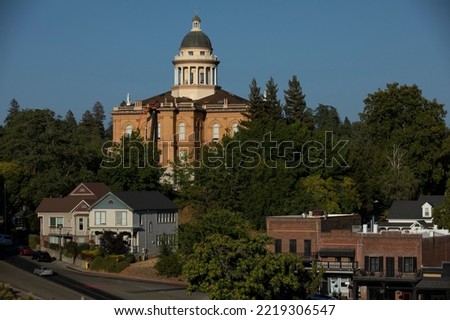 Sunlight shines on the historic 1898 Courthouse in downtown Auburn, California, USA. Royalty-Free Stock Photo #2219306547