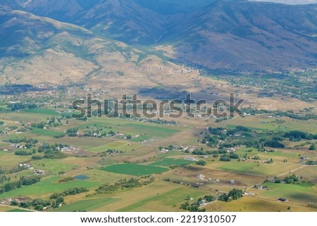 Summer mountain landscape in the USA. Sunny day and cloudy sky, Village view from top of the rock