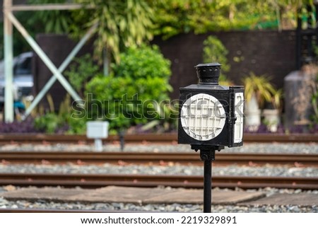A train traffic direction signal ligting equipment, using to control the train moving on the track. Symbol transporation equipment object.