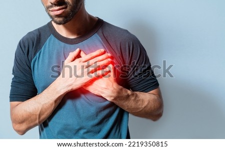 People with chest pain isolated, young man with tachycardia, man with heart pain on isolated background, young man with heart pain. Concept of people with heart problems Royalty-Free Stock Photo #2219350815