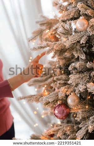 Christmas background, pine branches festive background. Creative composition with border and copy space. Christmas decoration with bokeh lights from light bulbs