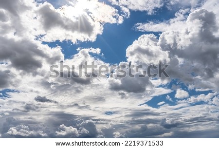 White clouds in a beautiful sky and its reflection