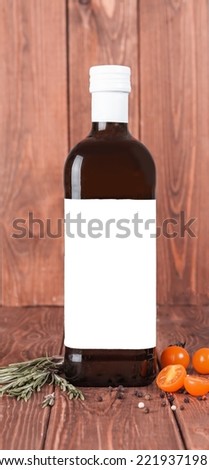 Bottle with oil and white label for your design