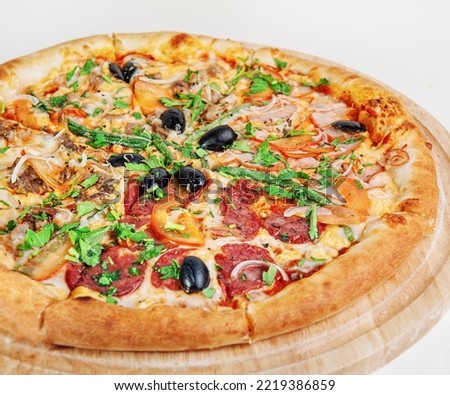 Fresh tasty pizza. Pizza with ham, corn and olives. Healthy food. Diet dish. Restaurant menu. 