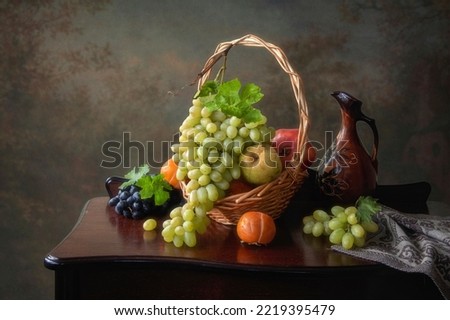 Still life with fruits and jug of wine