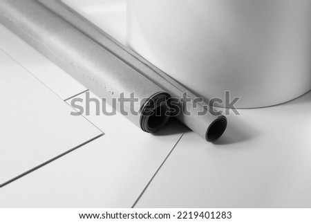 Design Studio. Variety of Blueprints Paper Sheets and Rolls on Office Desk. 