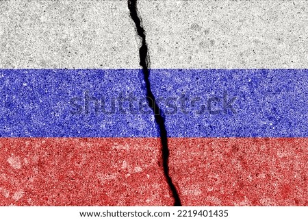 Russian Federation flag on cracked concrete wall. The concept of crisis, default, economic collapse, pandemic, conflict, terrorism or other problems in the country. Abstract disaster symbol.