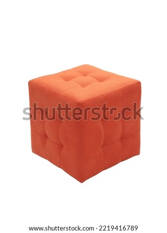 unusual modern orange cubic padded stool upholstered with soft fabric in strict style isolated on white background. creative approach to making furniture in shape of geometric figures Royalty-Free Stock Photo #2219416789