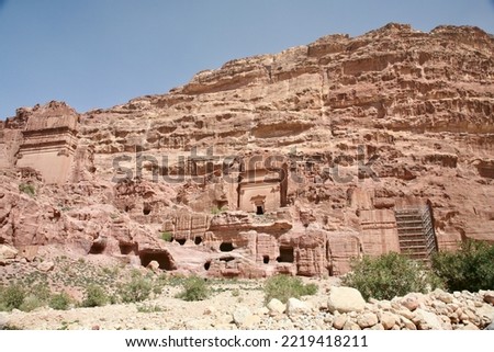 Petra, Jordan, November 2019 - A large stone building with Petra in the background