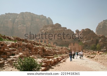Petra, Jordan, November 2019 - A large stone building with a mountain in the background