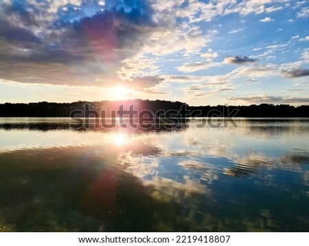 Beautiful landscape at a lake with a reflective water surface.