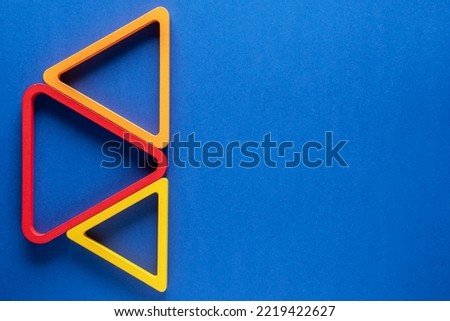 Abstract geometric background. Triangle background.
Three colorfull triangle on blue background