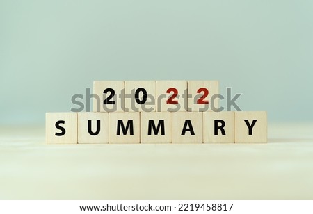2022 year summary text on wooden cube blocks on smart grey background. Past performance analysis for learning and  improvement. Preparation for annual plan for the next year. End of year concept. Royalty-Free Stock Photo #2219458817