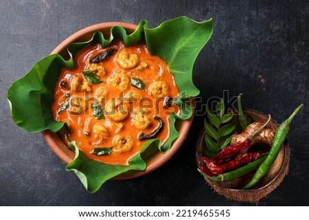Prawn mango curry. Kerala food Chemmeen Manga shrimp in coconut milk. Spicy fish curry popular Indian seafood served as side dish for rice. Also popular in Goa Tamil Nadu Bengal Sri Lankan Royalty-Free Stock Photo #2219465545