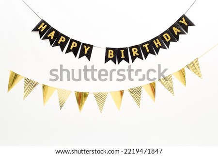 garland with flags. Decorative colorful pennants for birthday celebration Royalty-Free Stock Photo #2219471847