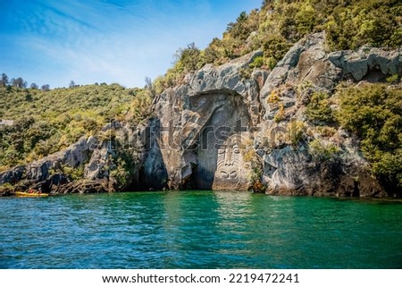 traditional rock carving lake taupo north island new zealand. High quality photo Royalty-Free Stock Photo #2219472241