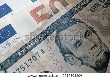 Banknotes of dollars and euros. The economy is global