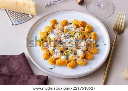 Pumpkin gnocchi with Parmesan cheese and herbs. Healthy eating. Vegetarian food. Diet.