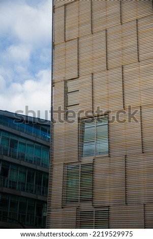 Facades of modern buildings. glass, metal, reflections, design, symmetry, modern architecture.