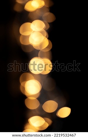 bokeh lights on black background, vertical photo