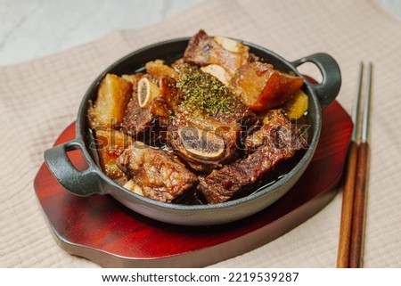 galbijjim, Korean Braised Short Ribs : Beef short ribs, trimmed of fat, seasoned in sweet soy sauce, and braised until tender with carrots, chestnuts, ginko nuts, and other vegetables. Royalty-Free Stock Photo #2219539287