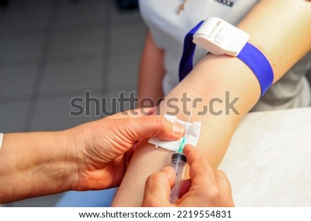 Doctor making vaccination ingection, isolated on white. Medicine and healthcare concept.