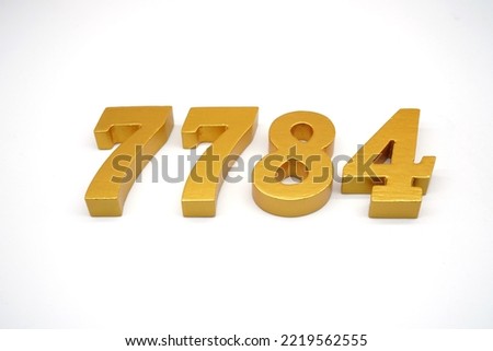  Number 7784 is made of gold-painted teak, 1 centimeter thick, placed on a white background to visualize it in 3D.                                    