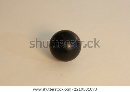rink hockey black ball. Sphericity concept, sphere Royalty-Free Stock Photo #2219581093