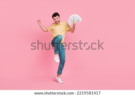 Full length photo of successful lucky man rejoice win gambling esport career promotion empty space isolated on pink color background