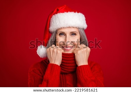 Photo of cheerful nice grandma hold scarf enjoy comfy warmth wear hat sweater isolated red color background Royalty-Free Stock Photo #2219581621
