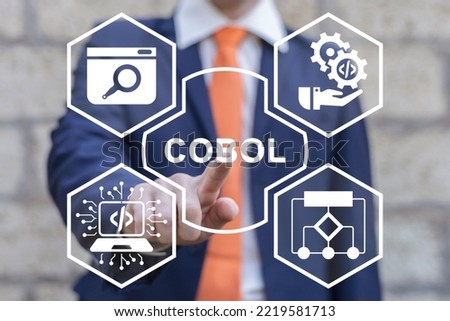 Businessman using virtual touchscreen clicks word: COBOL. Concept of cobol business programming language use. Cobol - Common Business Oriented Programming Language. 