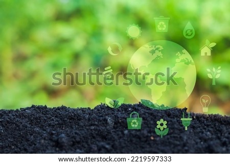 Save environment and plant concept, Recycling symbol Reuse Waste minimisation, Energy and Environmental Protection, saving plant life. Royalty-Free Stock Photo #2219597333