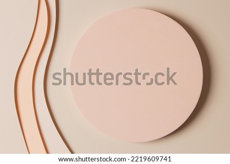 Blank round geometric shape podium platform on paper cut abstract minimal geometric shape light brown background. Top view mock up for product display Royalty-Free Stock Photo #2219609741