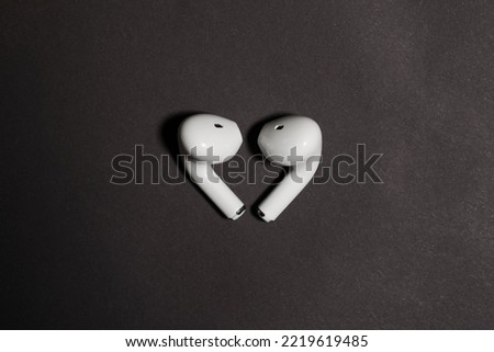 wireless headphones on grey background mockup top view close-up
