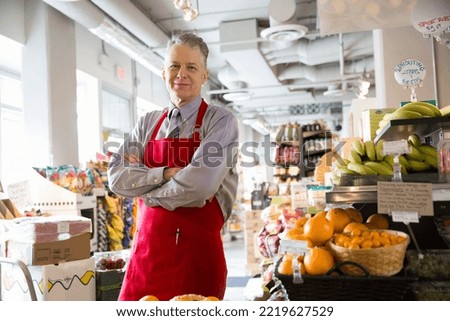 Portrait of confident worker in market