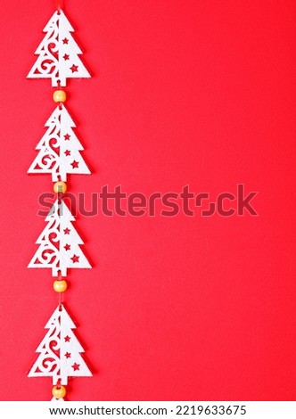 Christmas garland on a red background close-up