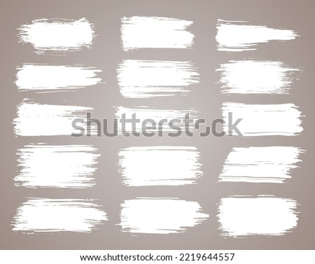 Paint brush. White ink grunge brush strokes. Vector paintbrush set. Grunge design elements. Painted ink stripes. Creative isolated spots. Ink smudge abstract shape stains and smear set