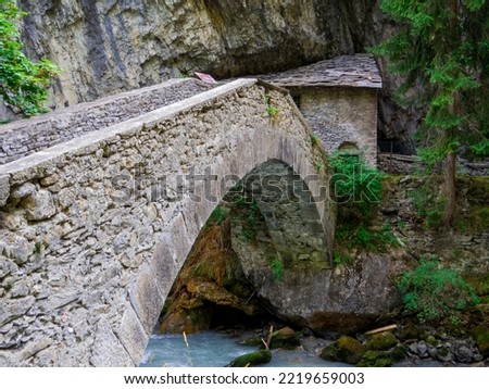 View of the bridge on the Dorea Baltea River in Pre-Saint-Didier, Aosta Valley, north Italy Royalty-Free Stock Photo #2219659003