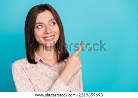 Close up photo of pretty young girl point look wondered empty space wear trendy smart casual garment isolated on cyan color background