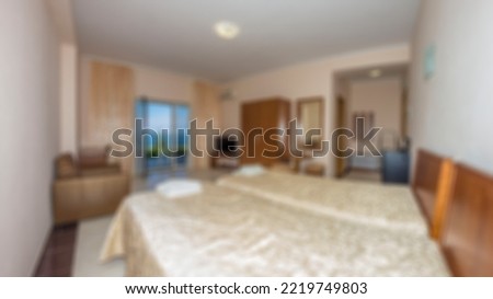 Defocused and blurred photo of luxury and modern bedroom with sea view in hotel apartment interior design. Ideal for background.