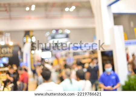 Royalty high quality free stock photo of abstract blur and defocused white modern car in car and motor exhibition show event with copy space for text or advertising or background. Bokeh in background.