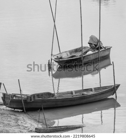 a minimalist photo of fresh water fishing boat at Lake Bukit Merah