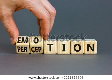 Emotion and perception symbol. Businessman turns wooden cubes and changes the word 'perception' to 'emotion'. Beautiful grey background. Business, emotion and perception concept. Copy space. Royalty-Free Stock Photo #2219813305