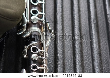 clarinet instrument on old black wooden floor copy space vintage picture tones selectable focus