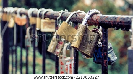 Locks are hanging on the rolling of the bridge with Blur Background, Bridge Love, Lock and Key Connection 
