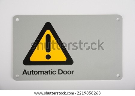 Automatic electric gate opener sign on a white